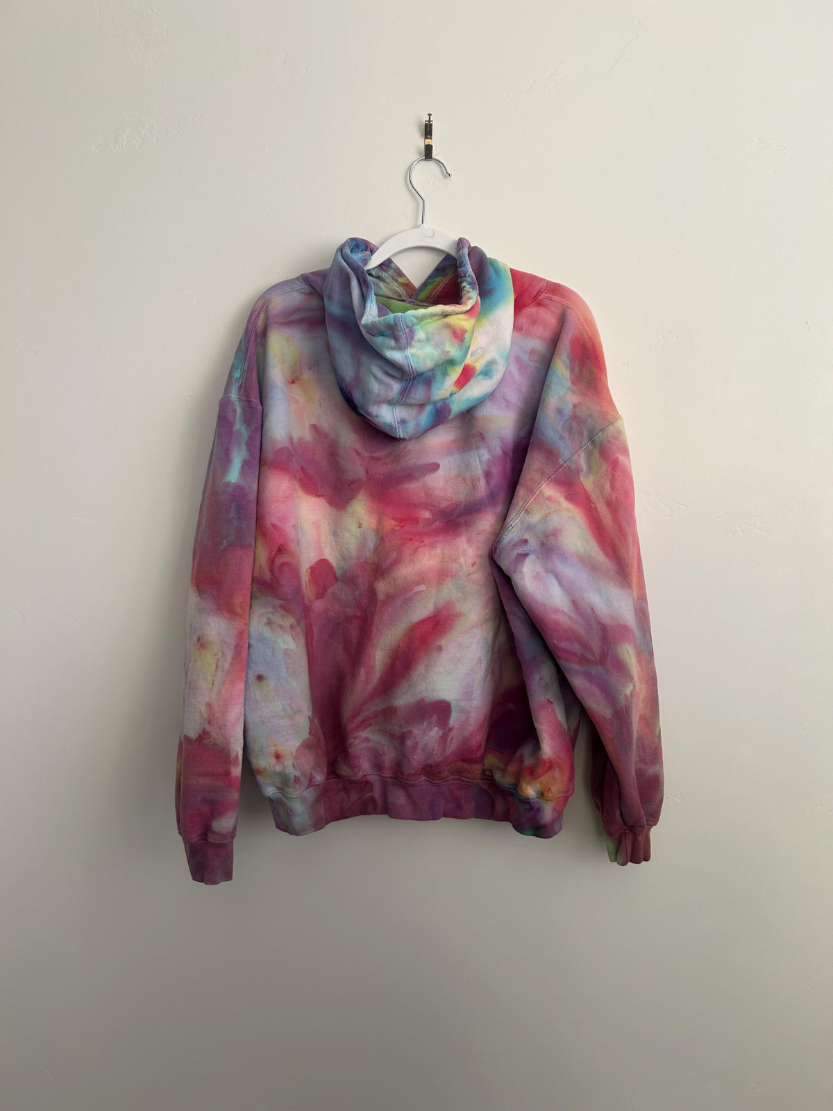 Unique hand-dyed wearable art hoodie. An ideal  personalized gift for teenagers or a colorful  statement piece for a summer evening bonfire or  beach trip.