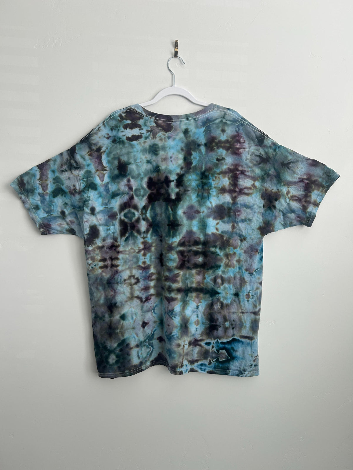 Back view of ice dyed tie dye shirt showing full pattern coverage in blue purple and black adult unisex 2XL shirt