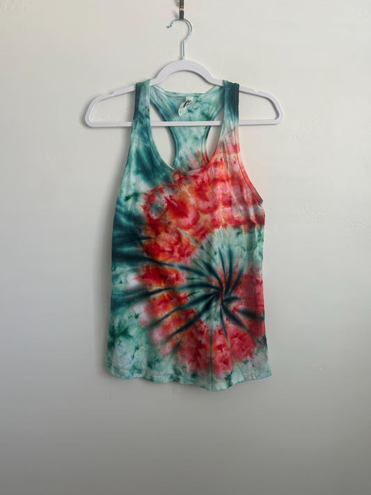 Full front view of a one of a kind teal and red spiral ice dye racerback tank on a hanger.