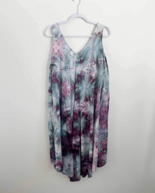 Ice dye hi-lo rayon dress in purple and teal floral pattern, full front view on hanger