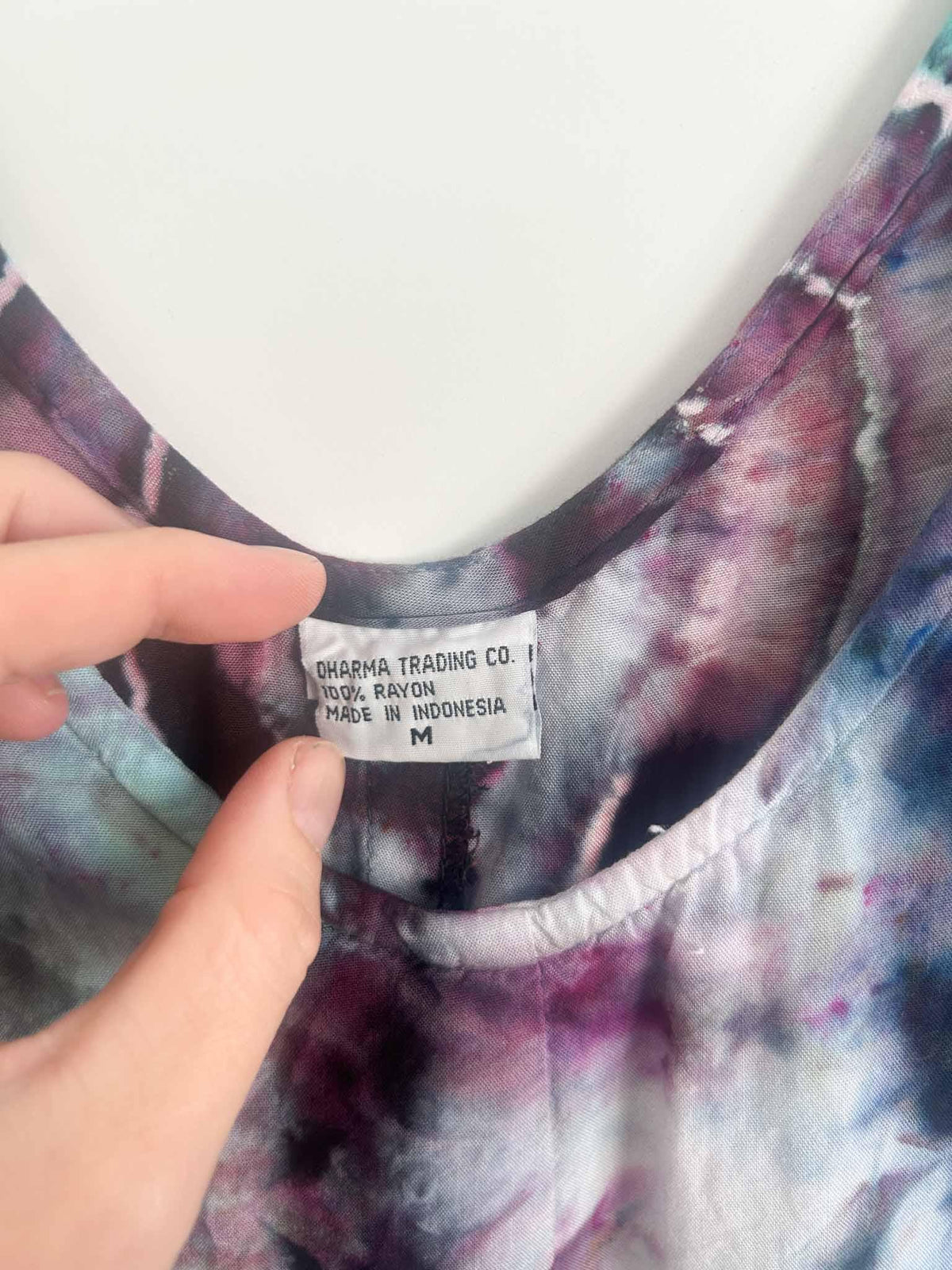 Dress care tag showing Dharma Trading Co., 100% rayon, size M, made in Indonesia