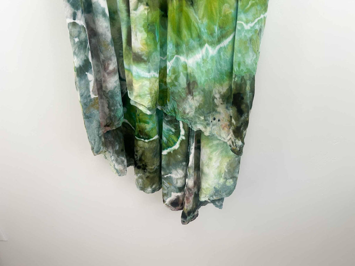Close-up of green geode ice dye hi-lo dress hem showing white crackle vein detail