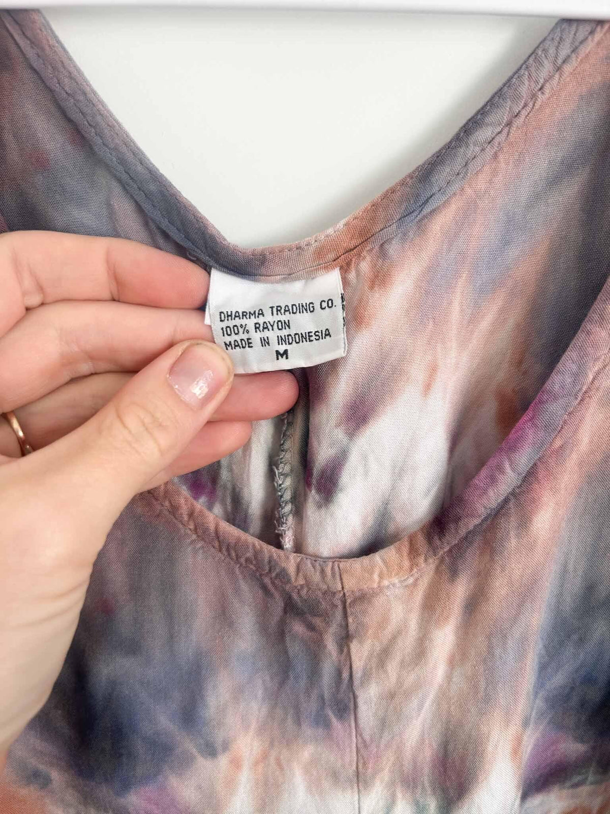 Dress care tag showing Dharma Trading Co., 100% rayon, size M, made in Indonesia