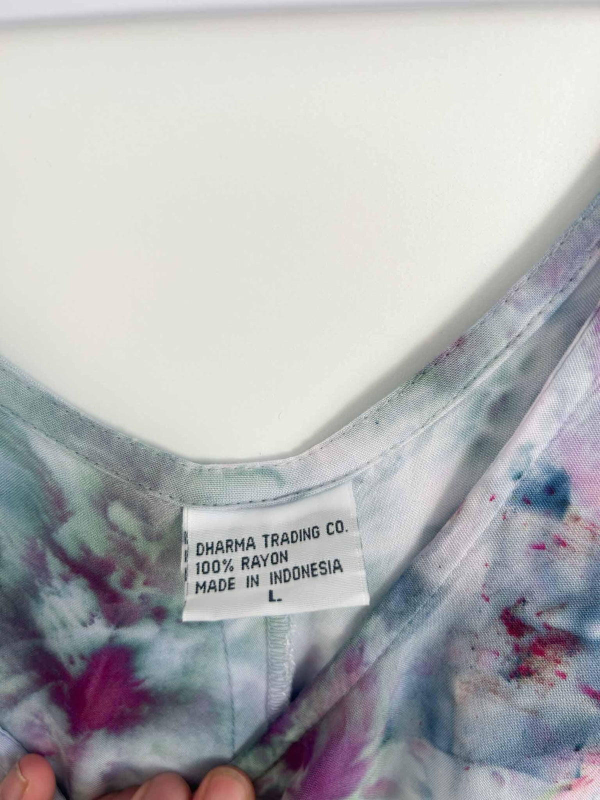 Dress care tag showing Dharma Trading Co., 100% rayon, size L, made in Indonesia