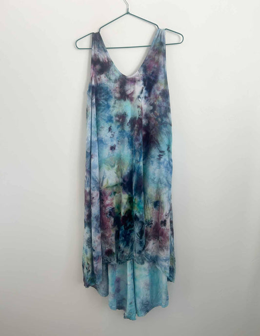 Ice dye hi-lo rayon dress in plum and teal scrunch pattern, full front view on hanger