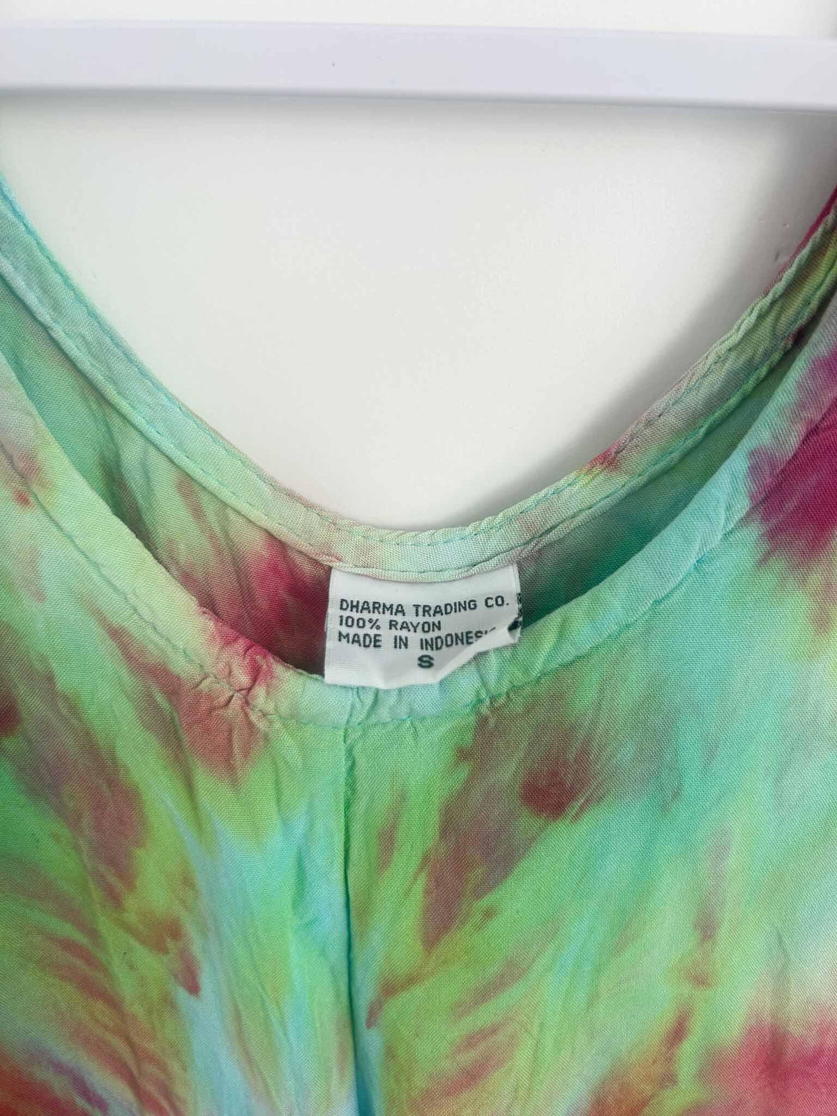 Dress care tag showing Dharma Trading Co., 100% rayon, size S, made in Indonesia