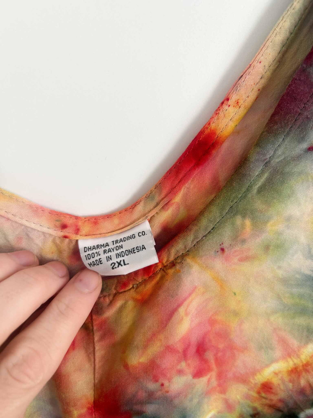 Dress care tag showing Dharma Trading Co., 100% rayon, 2XL, made in Indonesia