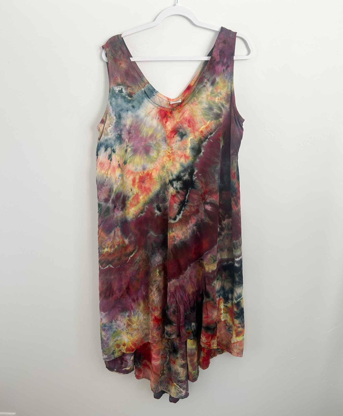 Moody geode ice dye rayon hi-lo dress in burgundy and red, full front view on hanger
