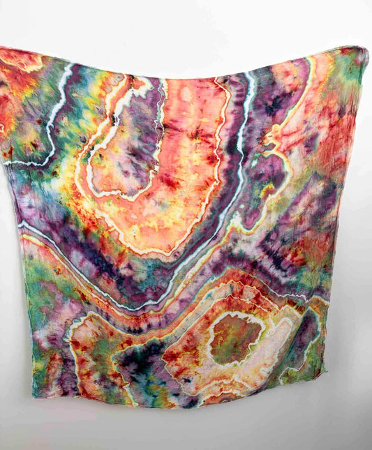 Tie dye bamboo gauze swaddle blanket in geode ice dye pattern, sunset pink purple and teal, 47x47 inches