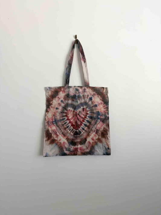 Burgundy and navy ice dye heart fold tote bag hanging, 100% cotton canvas with long handles