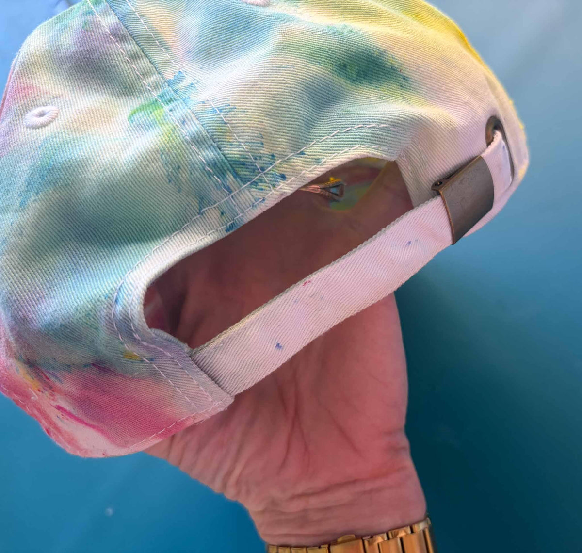 Rainbow tie dye baseball cap adjustable strap and buckle closure detail