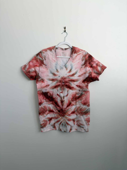 Rust red and pink ice dye v-neck shirt front view on hanger tie dye mandala