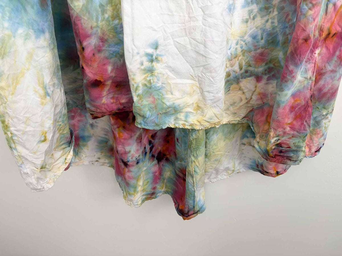 Hi-lo hem detail on rose and sage tie dye rayon dress