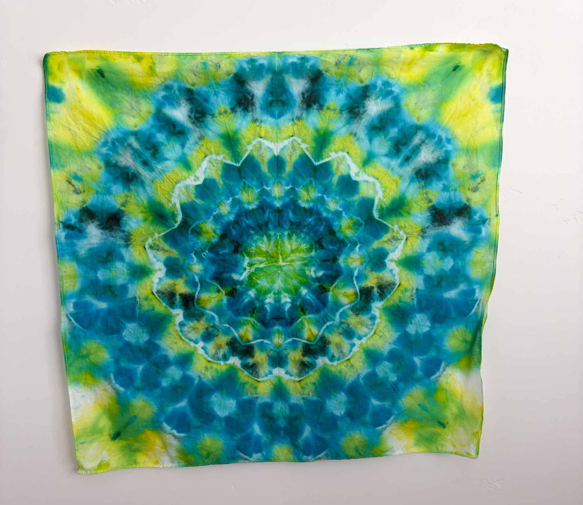 Green blue mandala tie dye bandana 22x22 inches, ice dye kaleidoscope pattern flat lay