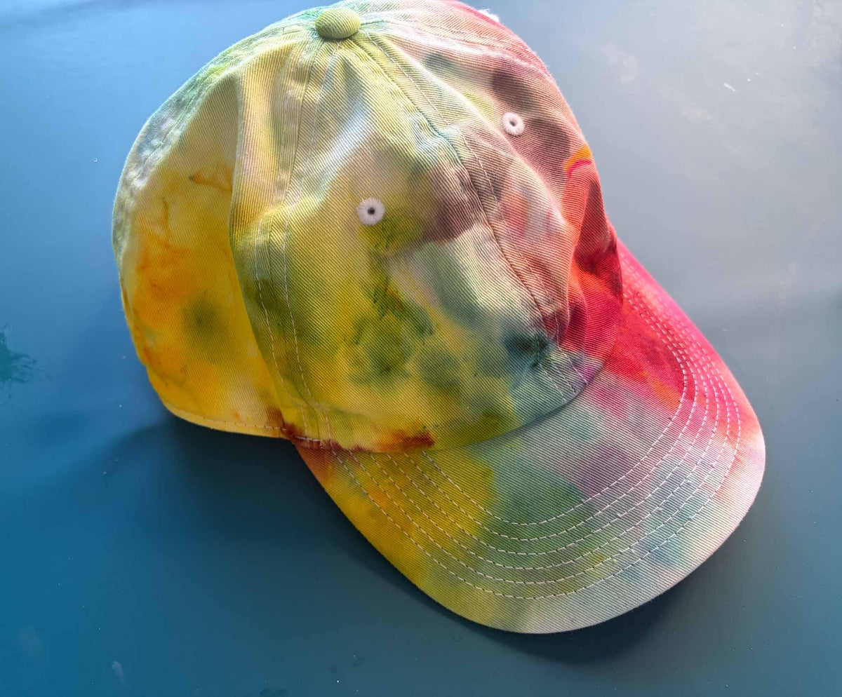 Rainbow tie dye baseball cap side view yellow green pink and blue