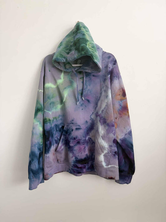 XL purple and green ice dye tie dye hoodie hanging, front view, handmade one of a kind