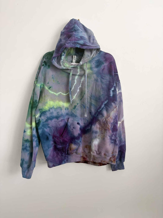 XL purple green and blue ice dye tie dye hoodie hanging, front view, handmade one of a kind