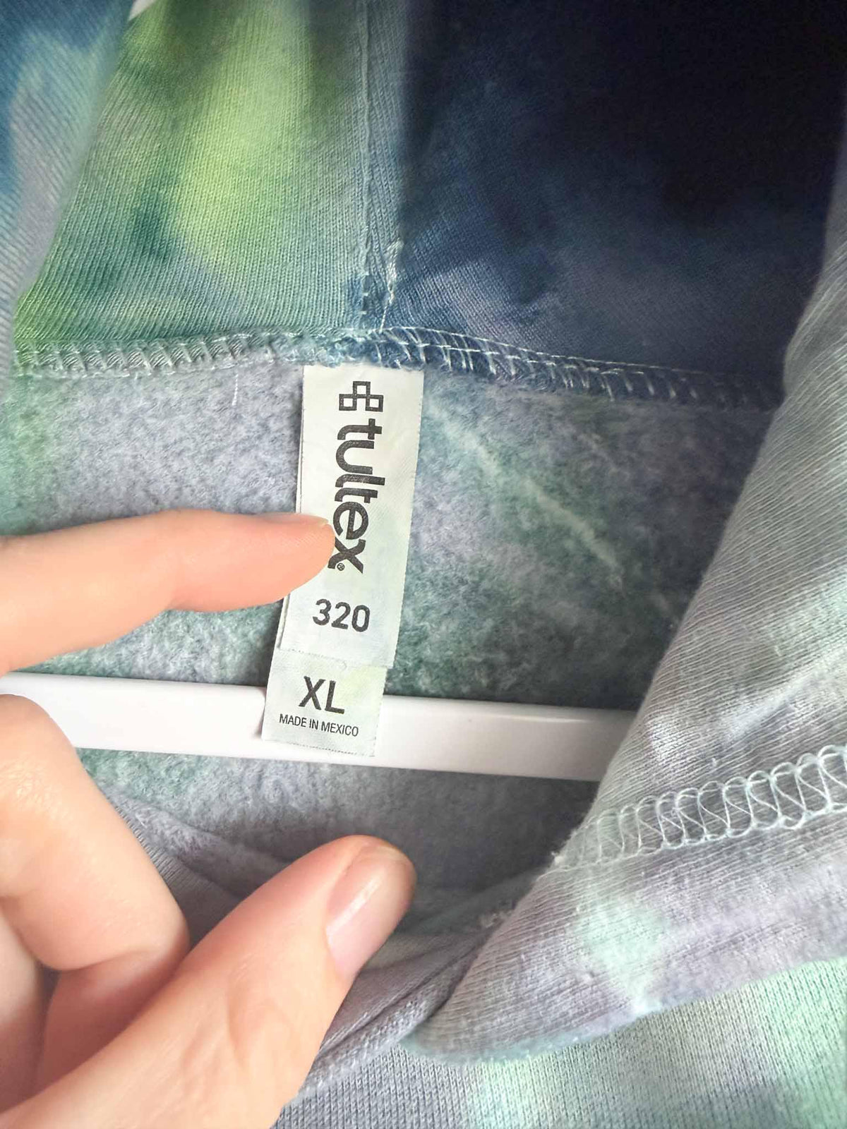 Tultex 320 XL tag on green and blue ice dye tie dye hoodie