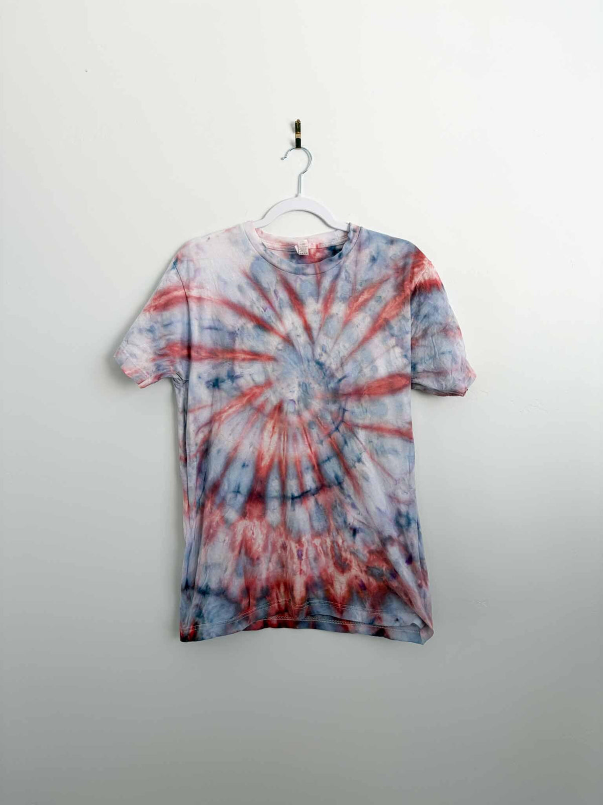 M red and gray spiral tie dye tee hanging, front view, handmade one of a kind