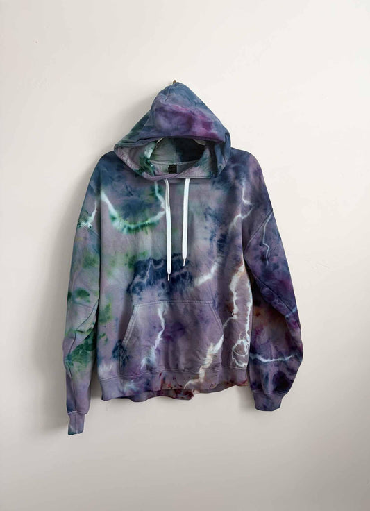 XL purple and green crinkle tie dye hoodie hanging, front view, handmade one of a kind