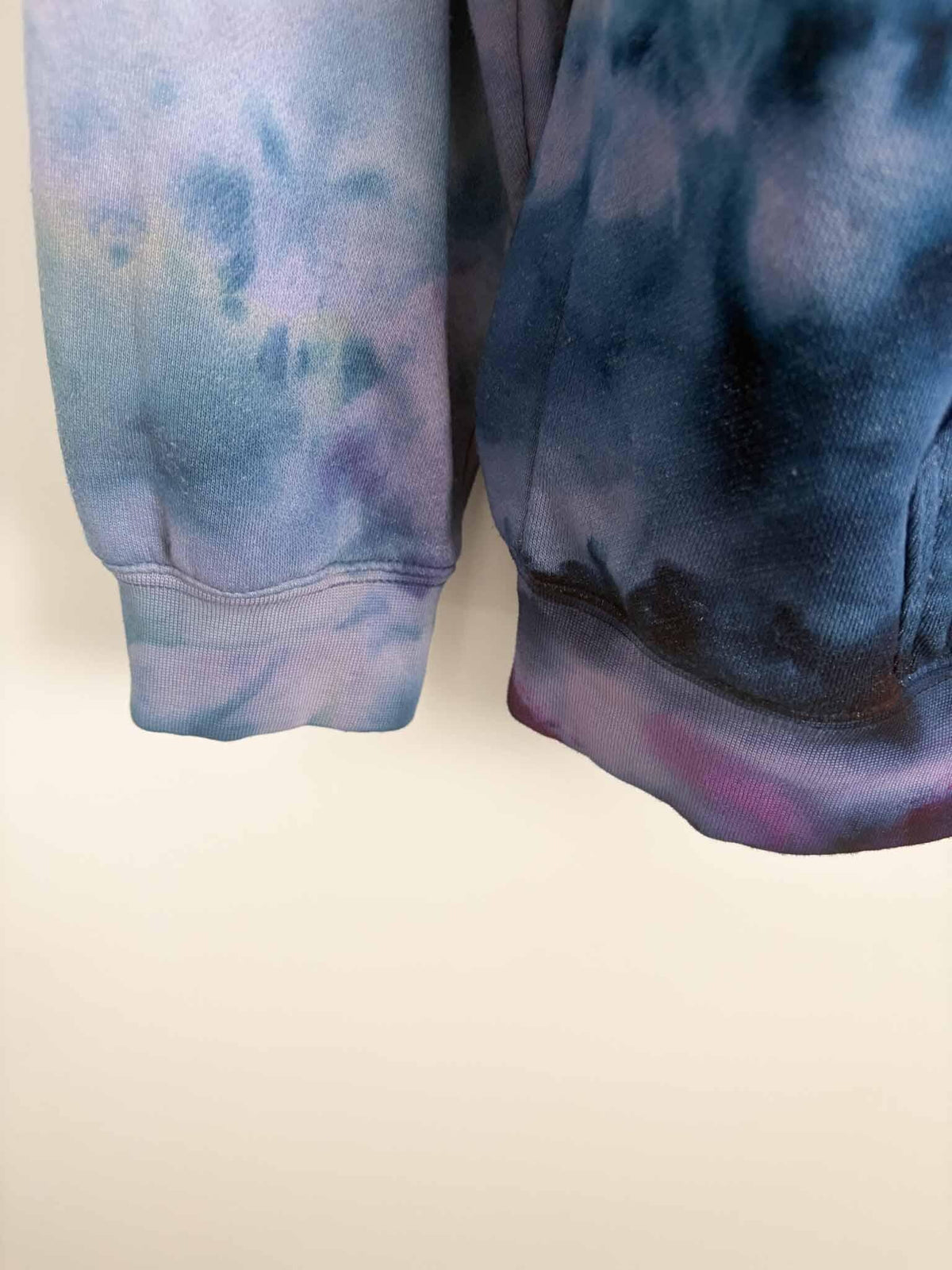 Close up of sleeve cuffs on XL blue and purple ice dye tie dye hoodie