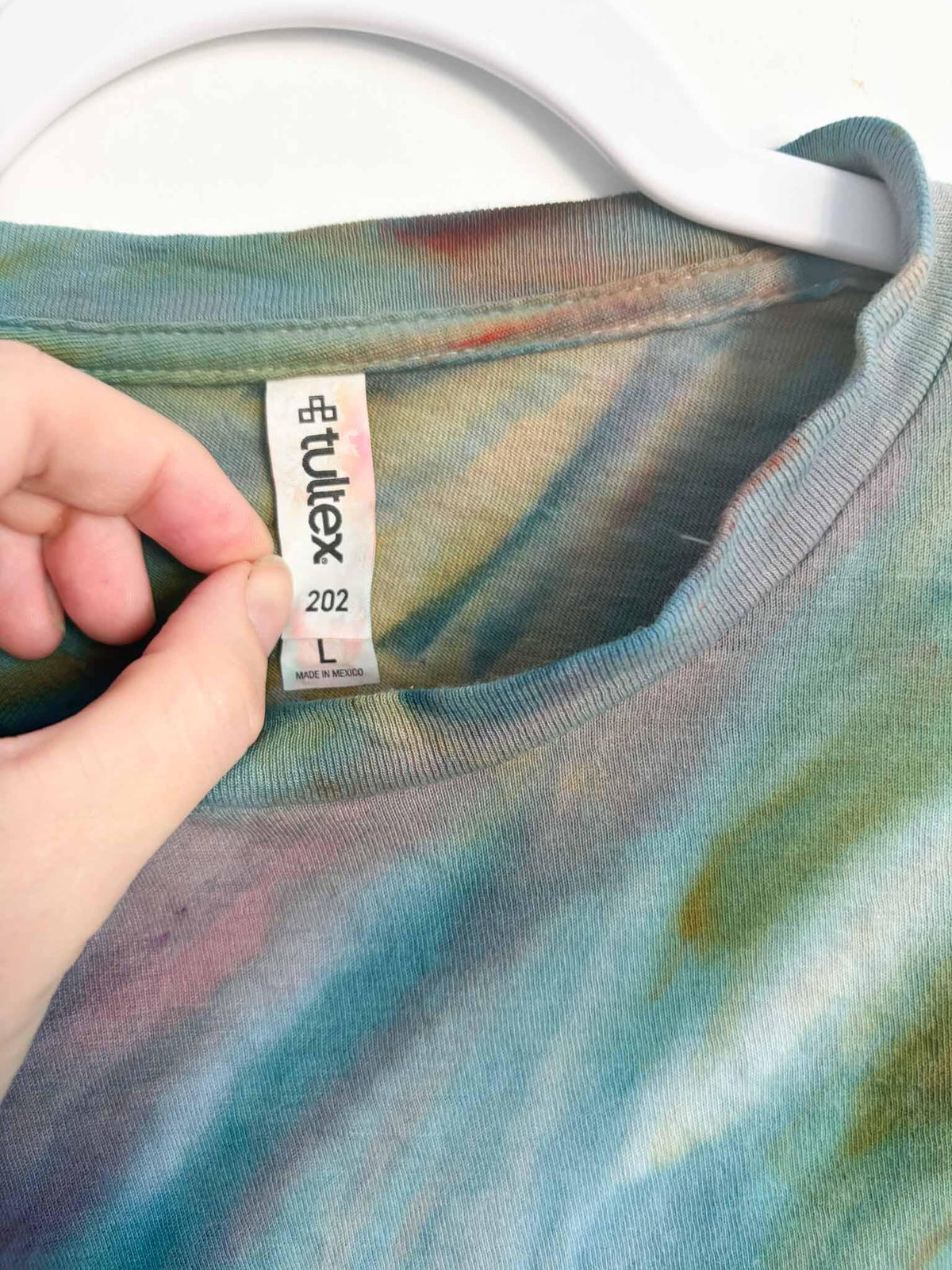 Tultex 202 L tag on teal and coral fern fold ice dye tie dye tee