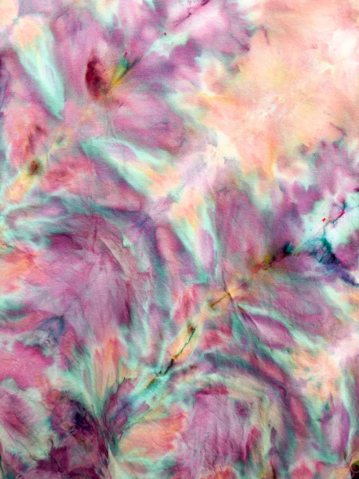 Close up of fern fold ice dye pattern on 3XL pink and purple tie dye tee