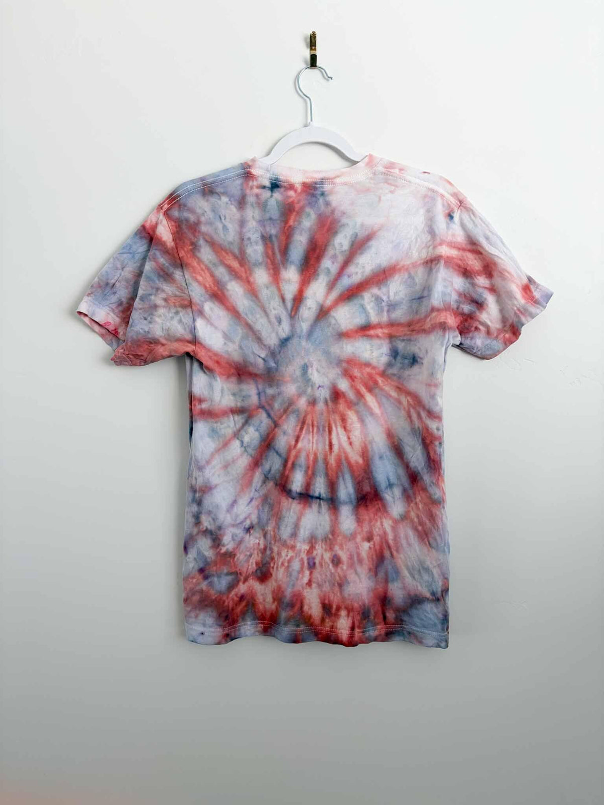 M red and gray spiral tie dye tee hanging, back view, handmade one of a kind